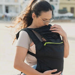 A lightweight, Boba Air Baby Travel Carrier with padded mesh straps, leg openings, adjustable shoulder straps, and an integrated hood. Compact and self-storing, it fits babies 4-24 months (15+ lbs) and children up to 45 lbs, Black