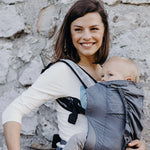 A lightweight, Boba Air Baby Travel Carrier with padded mesh straps, leg openings, adjustable shoulder straps, and an integrated hood. Compact and self-storing, it fits babies 4-24 months (15+ lbs) and children up to 45 lbs, Gray