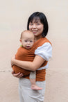 A Boba Classic Baby Wrap, made from a soft 95% French Terry cotton blend and 5% Spandex. Ergonomic, award-winning design fits babies from 7 Ibs to 35 Ibs, best up to 20 Ibs. Machine washable, dryer friendly, and certified hip-healthy. Camel