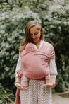 A Boba Classic Baby Wrap, made from a soft 95% French Terry cotton blend and 5% Spandex. Ergonomic, award-winning design fits babies from 7 Ibs to 35 Ibs, best up to 20 Ibs. Machine washable, dryer friendly, and certified hip-healthy. Dusty Pink