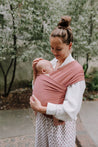 A Boba Classic Baby Wrap, made from a soft 95% French Terry cotton blend and 5% Spandex. Ergonomic, award-winning design fits babies from 7 Ibs to 35 Ibs, best up to 20 Ibs. Machine washable, dryer friendly, and certified hip-healthy. Dusty Pink