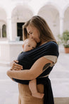 A Boba Classic Baby Wrap, made from a soft 95% French Terry cotton blend and 5% Spandex. Ergonomic, award-winning design fits babies from 7 Ibs to 35 Ibs, best up to 20 Ibs. Machine washable, dryer friendly, and certified hip-healthy. Navy Blue