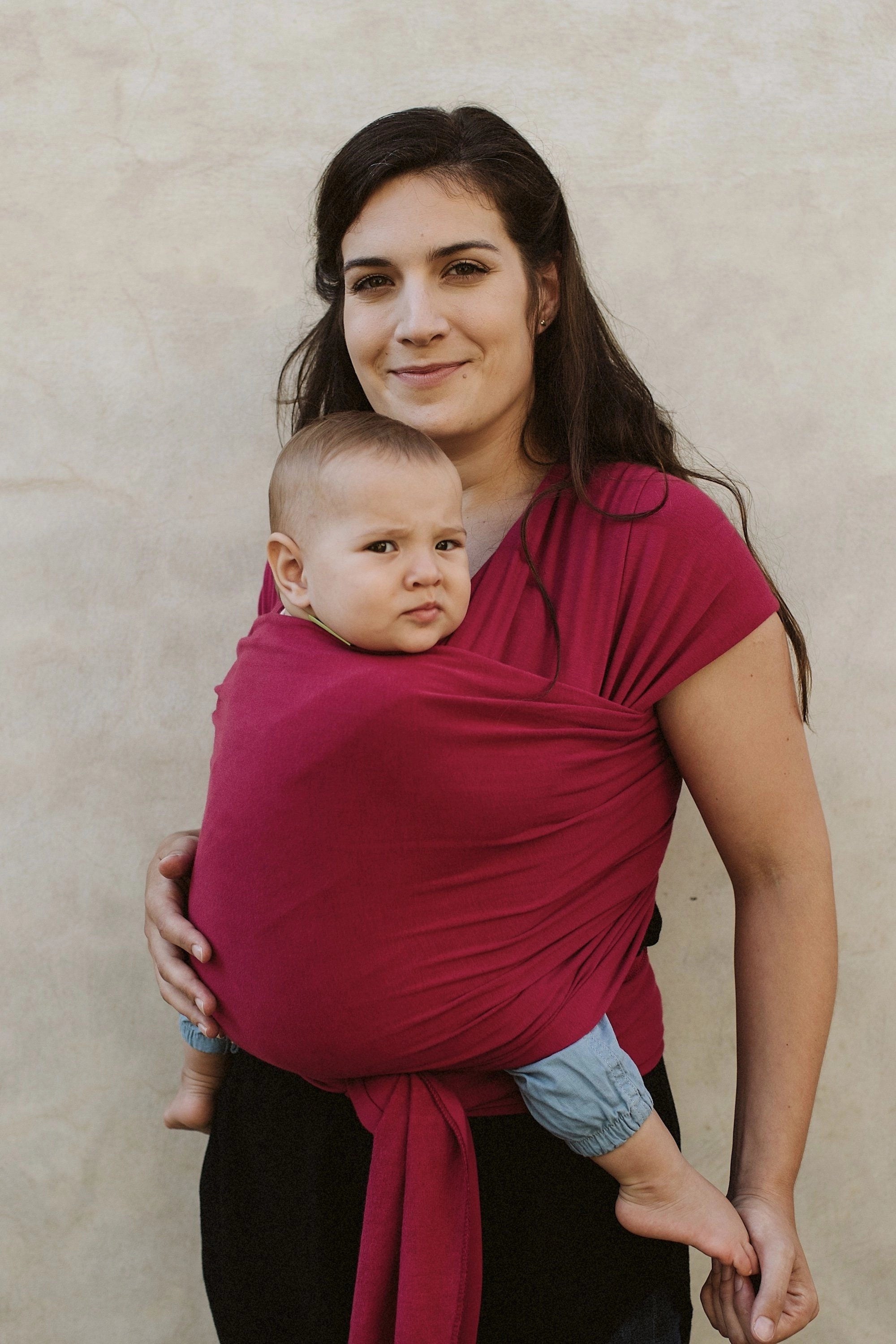 A Boba Classic Baby Wrap, made from a soft 95% French Terry cotton blend and 5% Spandex. Ergonomic, award-winning design fits babies from 7 Ibs to 35 Ibs, best up to 20 Ibs. Machine washable, dryer friendly, and certified hip-healthy. Sangria