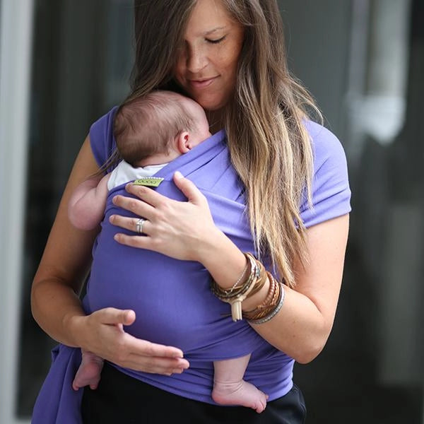 A Boba Classic Baby Wrap, made from a soft 95% French Terry cotton blend and 5% Spandex. Ergonomic, award-winning design fits babies from 7 Ibs to 35 Ibs, best up to 20 Ibs. Machine washable, dryer friendly, and certified hip-healthy. Purple