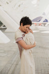 A Boba Ring Sling Baby Carrier made from a unique linen bamboo viscose fabric blend, perfect for all seasons. Lightweight and breathable, it stores compactly, ideal for newborn snuggles to toddler ups and downs (8 - 35Ibs). Pampas Beige