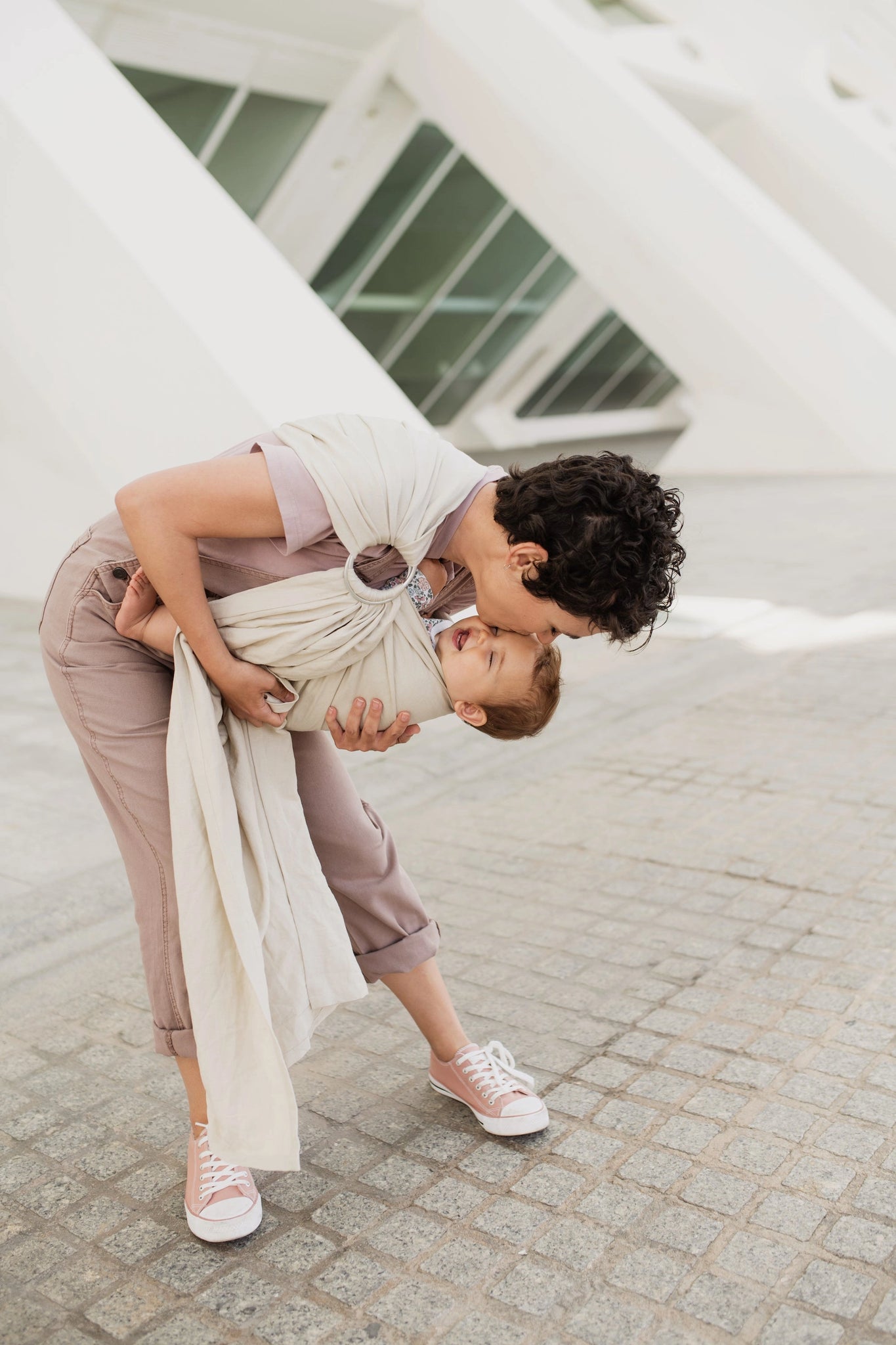 A Boba Ring Sling Baby Carrier made from a unique linen bamboo viscose fabric blend, perfect for all seasons. Lightweight and breathable, it stores compactly, ideal for newborn snuggles to toddler ups and downs (8 - 35Ibs). Pampas Beige