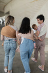 A Boba Ring Sling Baby Carrier made from a unique linen bamboo viscose fabric blend, perfect for all seasons. Lightweight and breathable, it stores compactly, ideal for newborn snuggles to toddler ups and downs (8 - 35Ibs).  Peony Pink