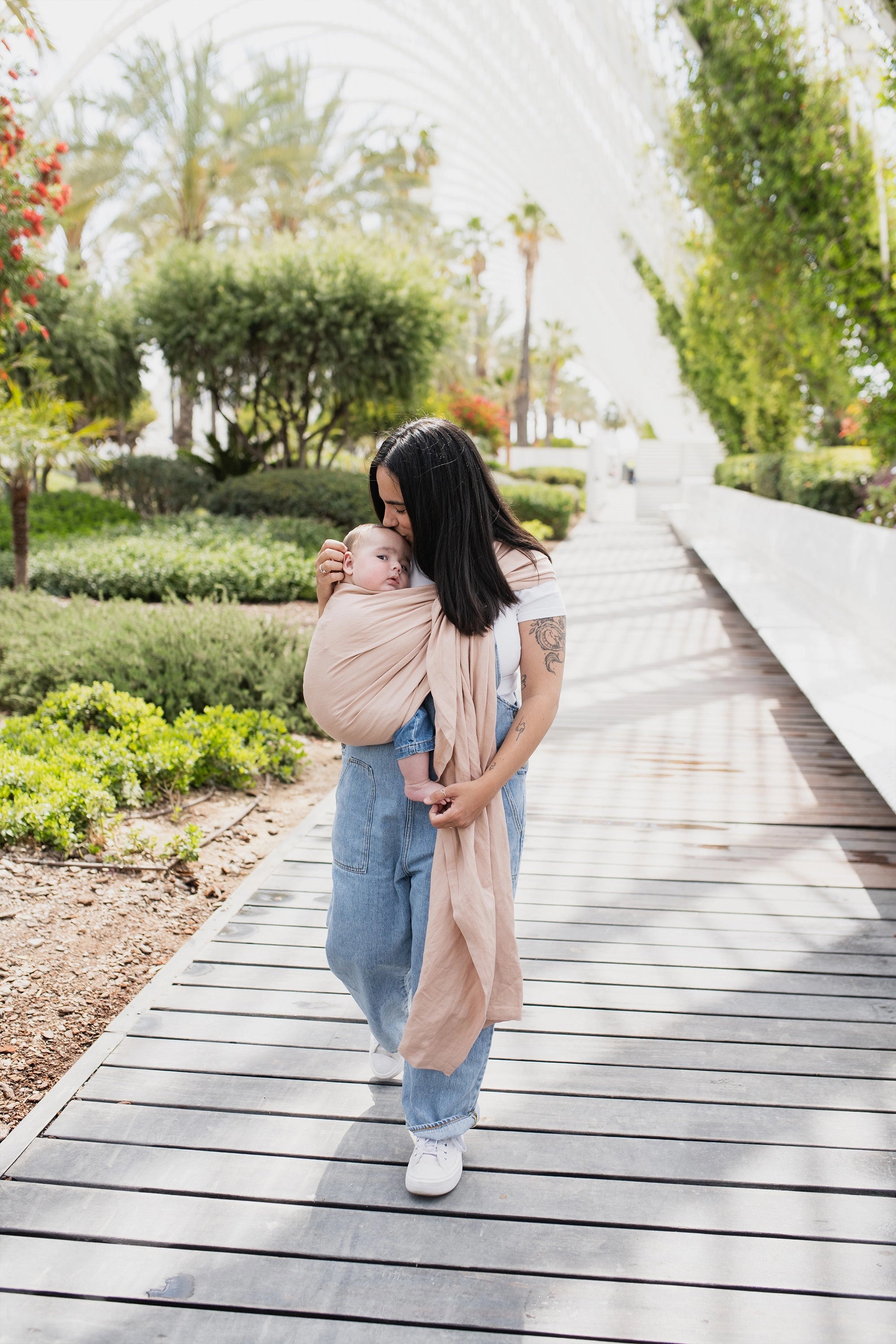 A Boba Ring Sling Baby Carrier made from a unique linen bamboo viscose fabric blend, perfect for all seasons. Lightweight and breathable, it stores compactly, ideal for newborn snuggles to toddler ups and downs (8 - 35Ibs).  Peony Pink