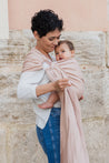 A Boba Ring Sling Baby Carrier made from a unique linen bamboo viscose fabric blend, perfect for all seasons. Lightweight and breathable, it stores compactly, ideal for newborn snuggles to toddler ups and downs (8 - 35Ibs).  Peony Pink