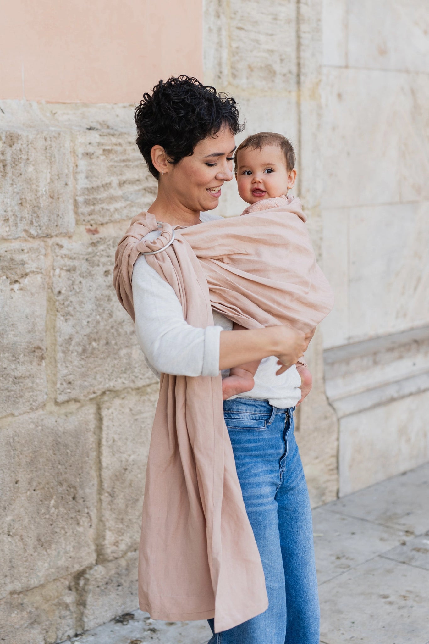 A Boba Ring Sling Baby Carrier made from a unique linen bamboo viscose fabric blend, perfect for all seasons. Lightweight and breathable, it stores compactly, ideal for newborn snuggles to toddler ups and downs (8 - 35Ibs).  Peony Pink