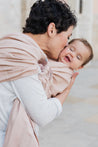 A Boba Ring Sling Baby Carrier made from a unique linen bamboo viscose fabric blend, perfect for all seasons. Lightweight and breathable, it stores compactly, ideal for newborn snuggles to toddler ups and downs (8 - 35Ibs).  Peony Pink