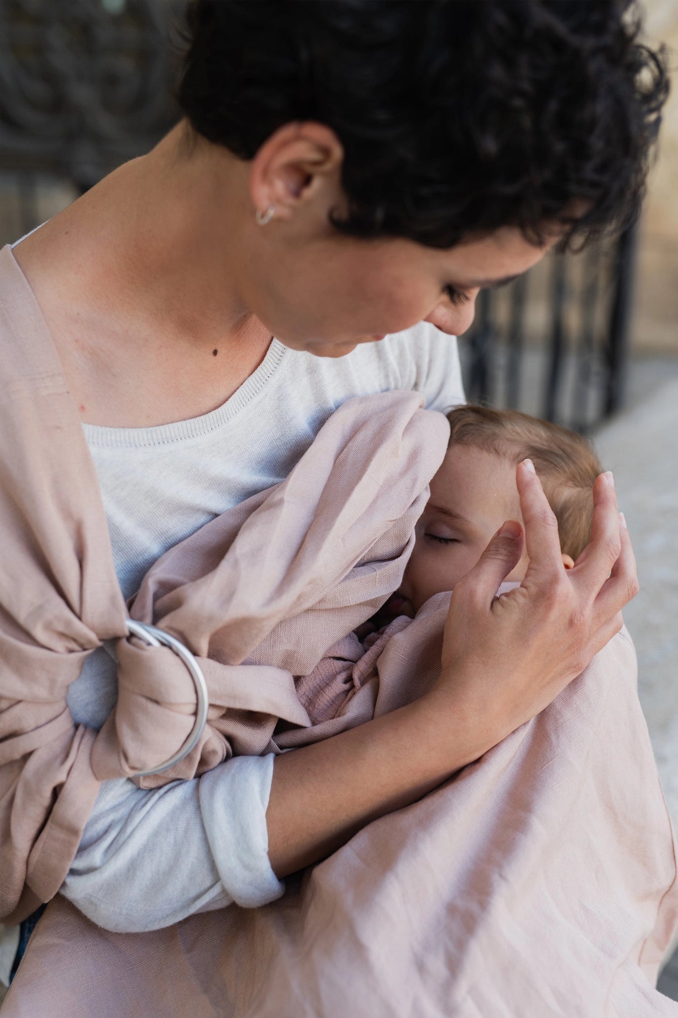 A Boba Ring Sling Baby Carrier made from a unique linen bamboo viscose fabric blend, perfect for all seasons. Lightweight and breathable, it stores compactly, ideal for newborn snuggles to toddler ups and downs (8 - 35Ibs).  Peony Pink