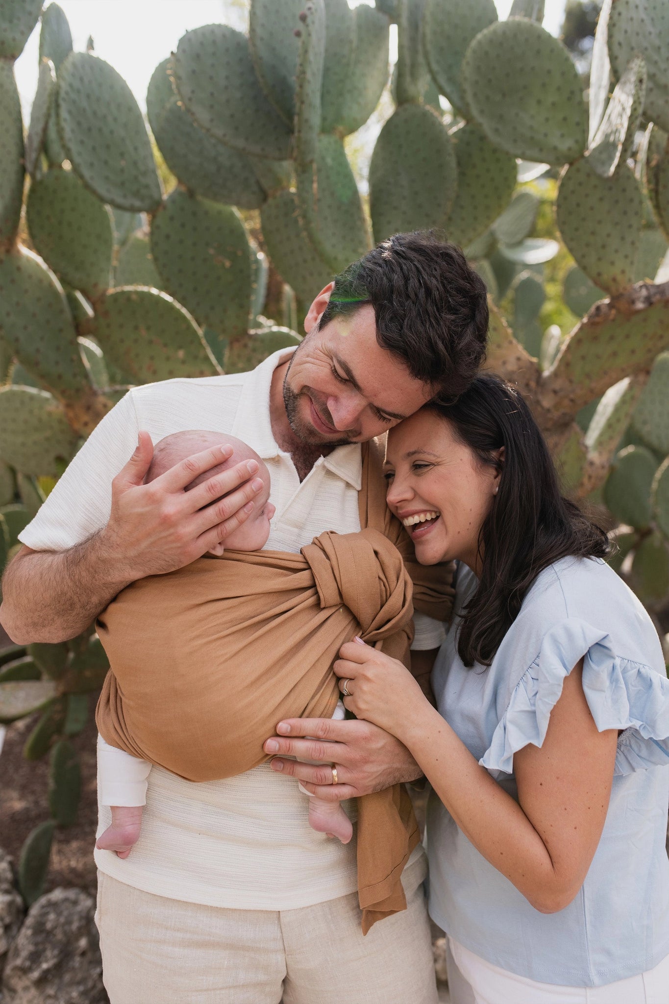 A Boba Ring Sling Baby Carrier made from a unique linen bamboo viscose fabric blend, perfect for all seasons. Lightweight and breathable, it stores compactly, ideal for newborn snuggles to toddler ups and downs (8 - 35Ibs). Rye Brown