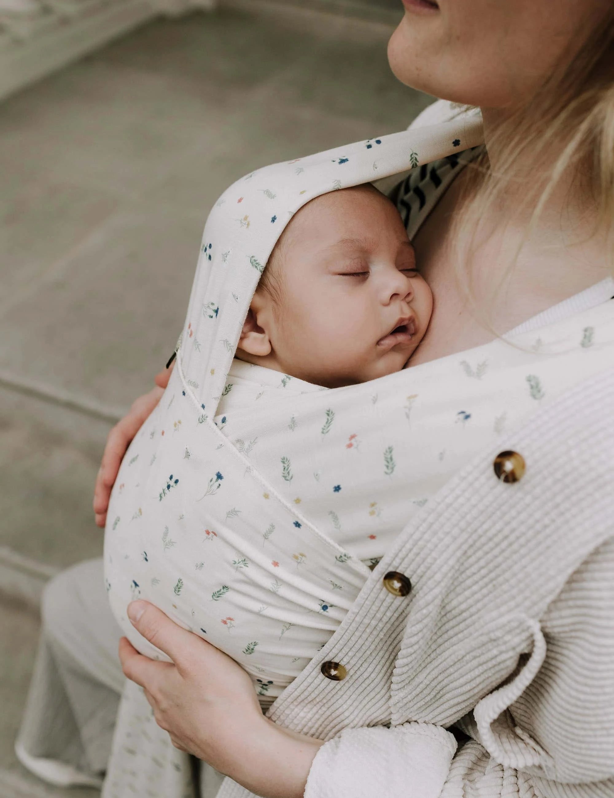 A Boba Serenity Baby Wrap, made from a buttery soft, extra breathable bamboo blend fabric (68% Viscose from Bamboo, 25% Cotton, 7% Spandex). Ergonomic, award-winning design fits babies from 7 Ibs to 35 Ibs, best up to 20 Ibs. Machine washable, dryer friendly, and certified hip-healthy. Achillea