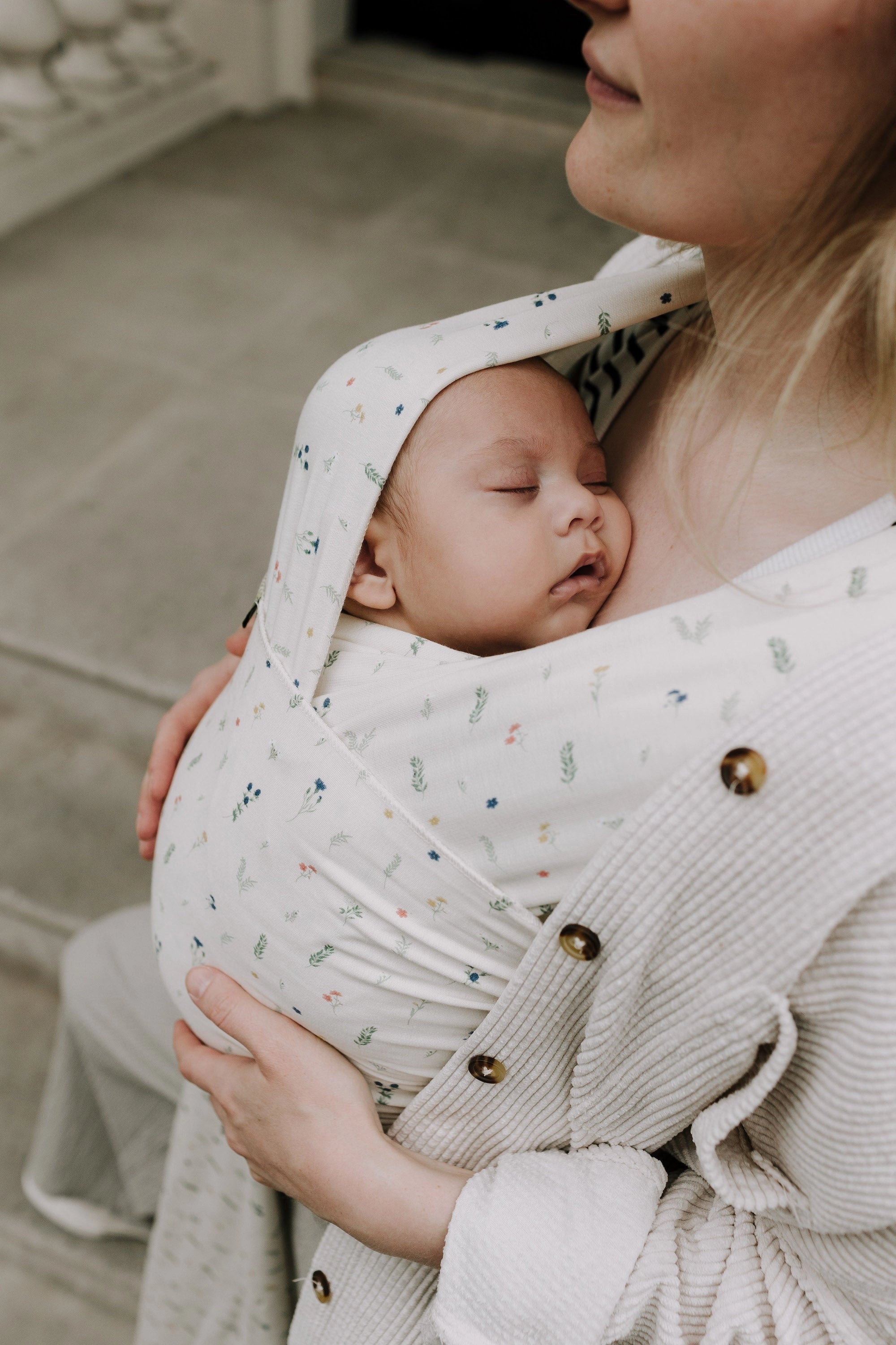 A Boba Serenity Baby Wrap, made from a buttery soft, extra breathable bamboo blend fabric (68% Viscose from Bamboo, 25% Cotton, 7% Spandex). Ergonomic, award-winning design fits babies from 7 Ibs to 35 Ibs, best up to 20 Ibs. Machine washable, dryer friendly, and certified hip-healthy. Achillea