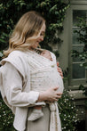 A Boba Serenity Baby Wrap, made from a buttery soft, extra breathable bamboo blend fabric (68% Viscose from Bamboo, 25% Cotton, 7% Spandex). Ergonomic, award-winning design fits babies from 7 Ibs to 35 Ibs, best up to 20 Ibs. Machine washable, dryer friendly, and certified hip-healthy. Achillea