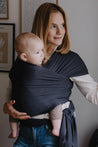 A Boba Serenity Baby Wrap, made from a buttery soft, extra breathable bamboo blend fabric (68% Viscose from Bamboo, 25% Cotton, 7% Spandex). Ergonomic, award-winning design fits babies from 7 Ibs to 35 Ibs, best up to 20 Ibs. Machine washable, dryer friendly, and certified hip-healthy. Charcoal