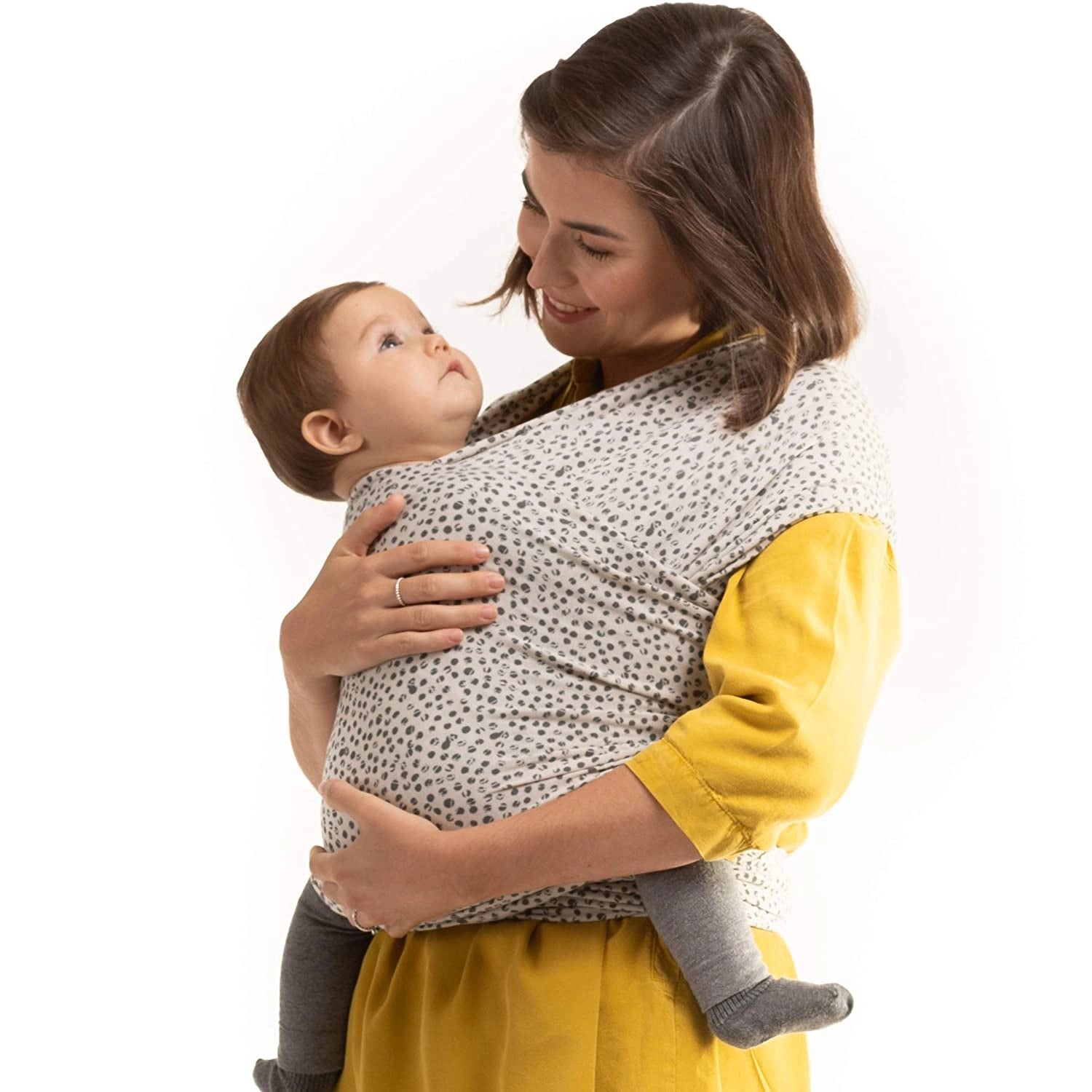 A Boba Serenity Baby Wrap, made from a buttery soft, extra breathable bamboo blend fabric (68% Viscose from Bamboo, 25% Cotton, 7% Spandex). Ergonomic, award-winning design fits babies from 7 Ibs to 35 Ibs, best up to 20 Ibs. Machine washable, dryer friendly, and certified hip-healthy. Cobblestone