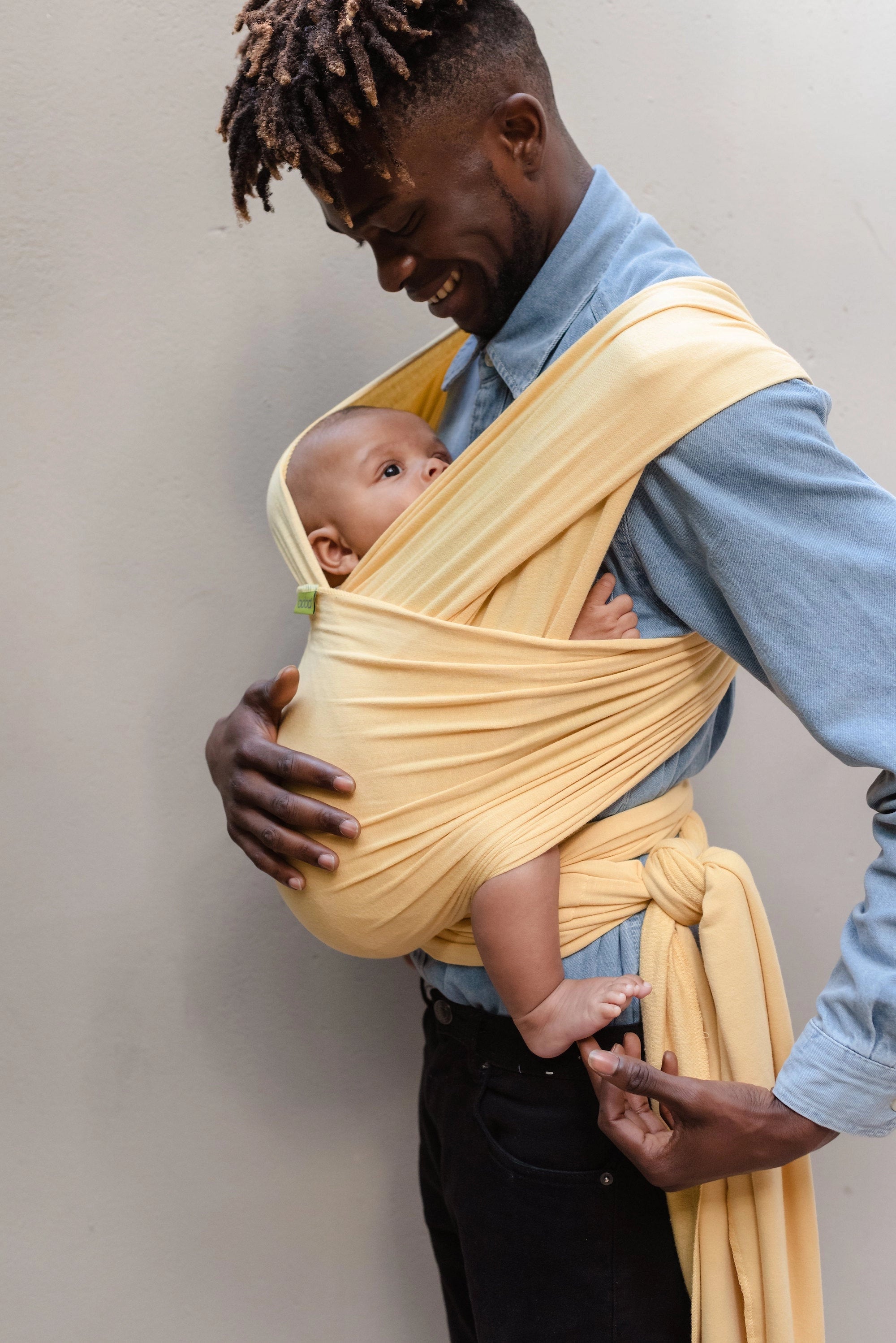 A Boba Serenity Baby Wrap, made from a buttery soft, extra breathable bamboo blend fabric (68% Viscose from Bamboo, 25% Cotton, 7% Spandex). Ergonomic, award-winning design fits babies from 7 Ibs to 35 Ibs, best up to 20 Ibs. Machine washable, dryer friendly, and certified hip-healthy. Flax