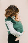 A Boba Serenity Baby Wrap, made from a buttery soft, extra breathable bamboo blend fabric (68% Viscose from Bamboo, 25% Cotton, 7% Spandex). Ergonomic, award-winning design fits babies from 7 Ibs to 35 Ibs, best up to 20 Ibs. Machine washable, dryer friendly, and certified hip-healthy. Organic Rainforest