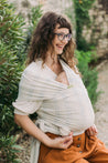 A Boba Serenity Baby Wrap, made from a buttery soft, extra breathable bamboo blend fabric (68% Viscose from Bamboo, 25% Cotton, 7% Spandex). Ergonomic, award-winning design fits babies from 7 Ibs to 35 Ibs, best up to 20 Ibs. Machine washable, dryer friendly, and certified hip-healthy. Riviera