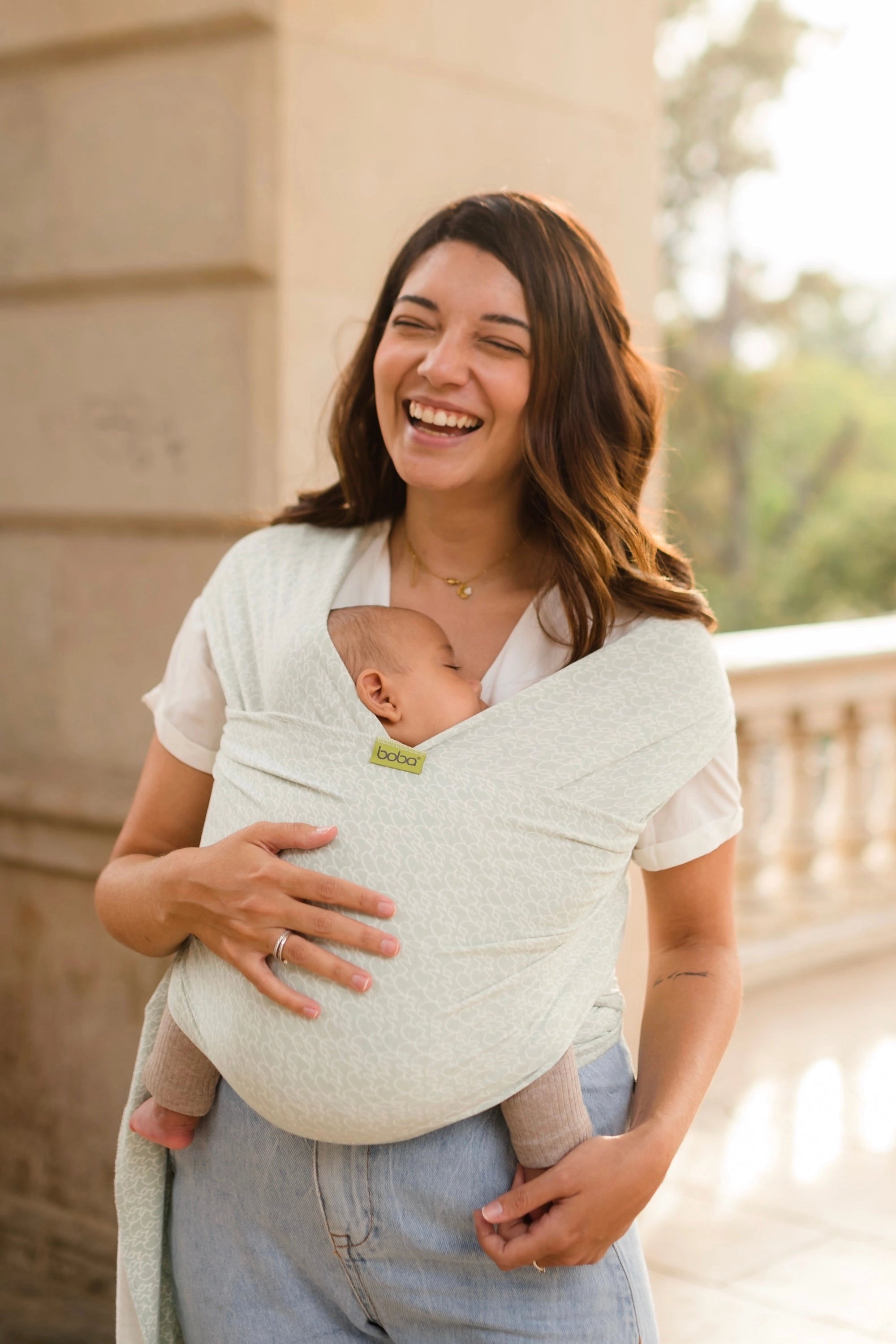 A Boba Serenity Baby Wrap, made from a buttery soft, extra breathable bamboo blend fabric (68% Viscose from Bamboo, 25% Cotton, 7% Spandex). Ergonomic, award-winning design fits babies from 7 Ibs to 35 Ibs, best up to 20 Ibs. Machine washable, dryer friendly, and certified hip-healthy. Whisper