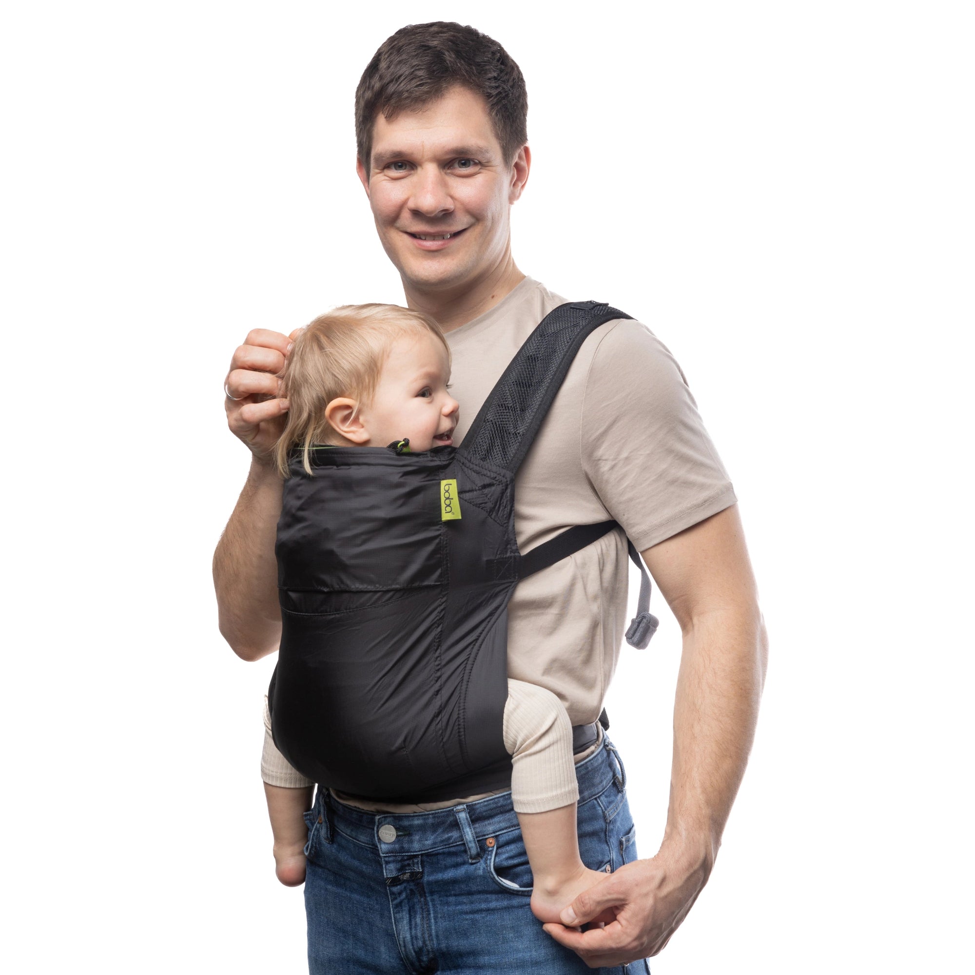 A lightweight, Boba Air Baby Travel Carrier with padded mesh straps, leg openings, adjustable shoulder straps, and an integrated hood. Compact and self-storing, it fits babies 4-24 months (15+ lbs) and children up to 45 lbs, Black